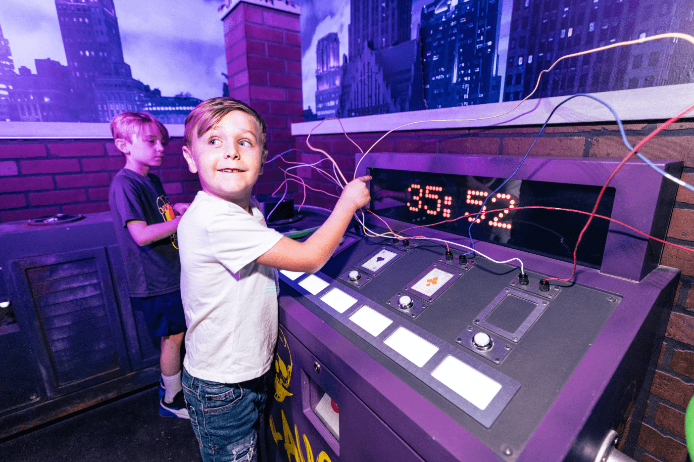 Kids next to countdown clock on wired device