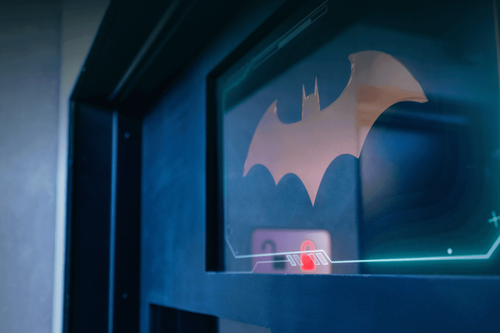 Close up of Batman symbol on screen