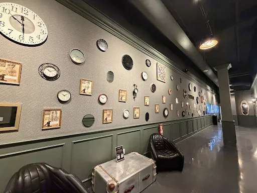 One of the interior walls full of clocks at Escapology Fresno